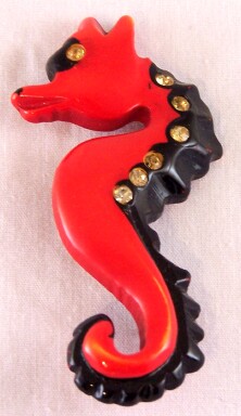 BP19 red overdye bakelite seahorse pin